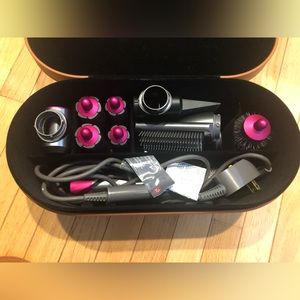 Dyson air wrap with brown leather case. Short barrels.